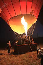 Woman climbs hot air balloon basket for adventure sport