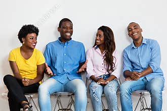 Talking african american group of people in waiting room