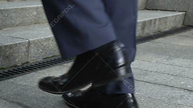 Man walking upstairs, concept of achievement, career ladder, successful startup