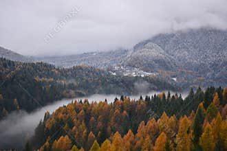 The fog in the valley of the river divides the autumn from winter