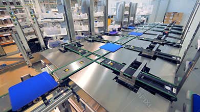 Factory facility with solar module cells being moved along the conveyor belt - Innovation technology concept.