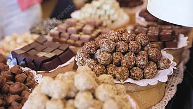 Chocolate store. Shelves with handmade sweets closeup