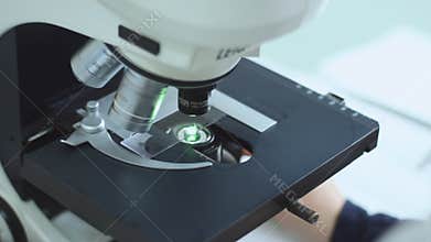 Microbiologist working with sample in biomedical laboratory
