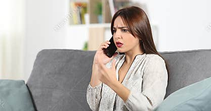 Angry customer calling support service on phone