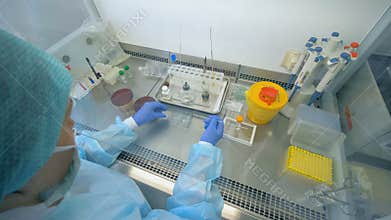 One person heating a stick on a beaker in a laboratory. Doping test concept.