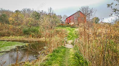 Rustic Pathway and Pond Leading up to Red Barn