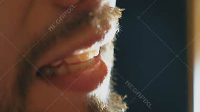 Mouth of male singer singing song in sound studio. Unrecognizable man with beard sings new song. Working of creative