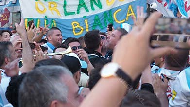 MOSCOW, RUSSIA, JUNE 20, 2018: Soccer World Cup Argentine football fans with flags at the on Nikolskaya Street, a crowd