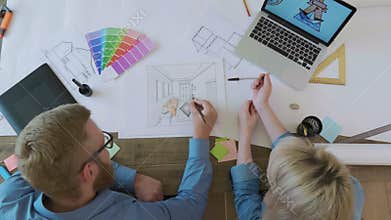 Top view interior designers working on the interior sketch
