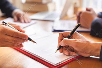 Co-investment business signing contract agreement after successful deal.