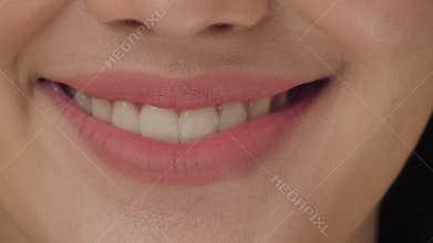Smiling woman mouth with great white teeth close up