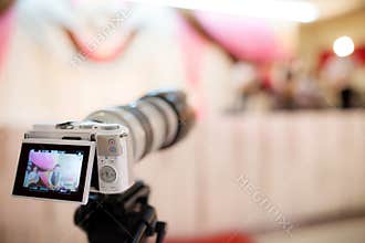 Video camera recording the great moment in wedding ceremony.