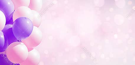 Frame of pastel party balloons on soft background