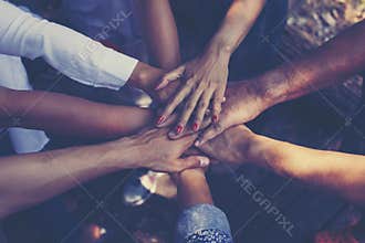 Team Work Concept : Group of Diverse Hands Together Cross Processing of young people in the nature