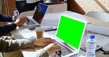 Female executive using laptop in office 4k