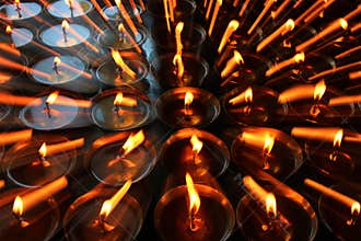 Charity. Praying candles in a monastery in Bhutan. Abstract, candlelight.