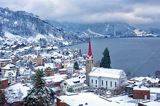 Weggis village on Lake Lucerne, swiss Alps mountains, Switzerland, in winter time