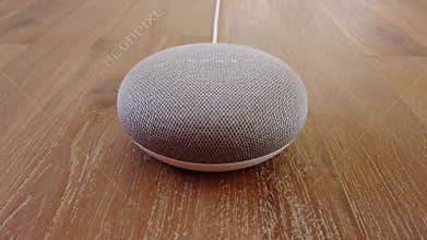 Google Home Mini - Mini Smart Home Voice Assistant Controlled Gadget Responding To Command