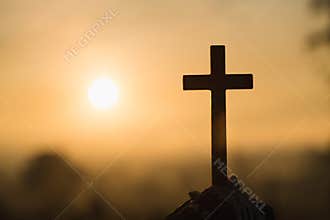 Jesus Christ cross. Easter, resurrection concept. Christian wooden cross on a background with dramatic lighting