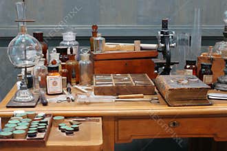 Old science lab with chemical reagents and burner