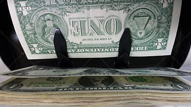 Electronic money counter machine is counting is counting the American hundred-dollar US dollars banknotes