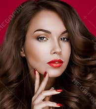 Girl fashion model with bright makeup and red manicure on the nails, lips . jewelry accessories . White background