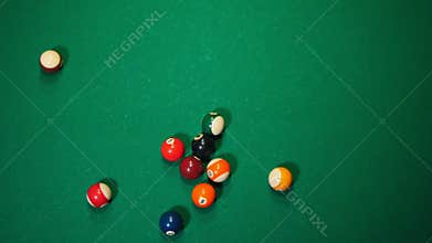 Billiards club. Colored balls. Breaking down the triangle form of the balls with a hit