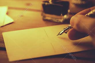 handwriting with quill pen and ink