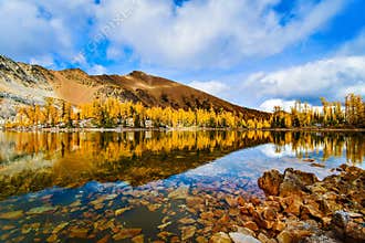 Fall Mountain Reflection with blue skies, British Columbia, Canada