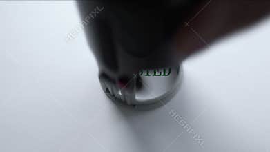 Tested seal stamped on blank paper background, approved results, examination