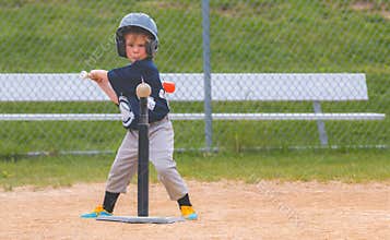 Young Child Playing Baseball