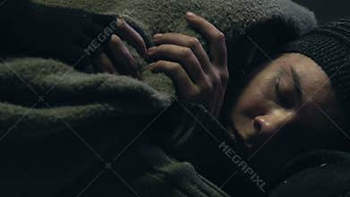 Beggar covering his homeless friend from cold, compassion and sympathy concept