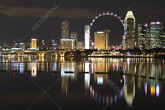 Singapore Flyer by Marina Bay at night
