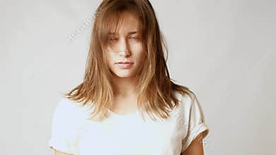 Young attractive woman sad about messy hair and long bangs