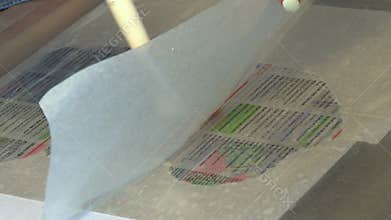 Restorers restore old archival documents, books and photographs.