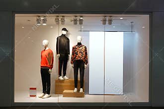 Clothing shop window male mannequins blank billboard
