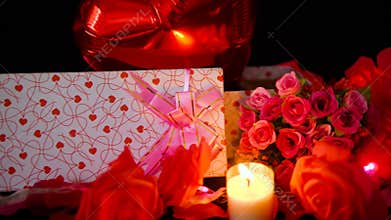 Footage of ballon, gift boxes, flower and candle burning. Valentine decoration