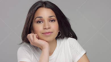 Young mixed race woman in studio in casual look