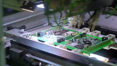 Electronic circuit board production. Automated circuit board machine produces printed digital electronic board