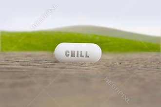 Chill word written on a white pill