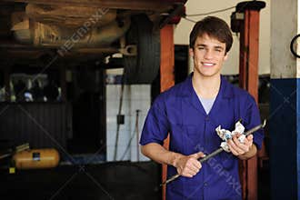 Car mechanic at work with copy space