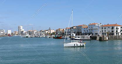 White sailboat on the channel
