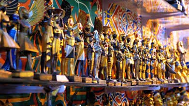 Different statuettes of Egyptian souvenirs on market stall