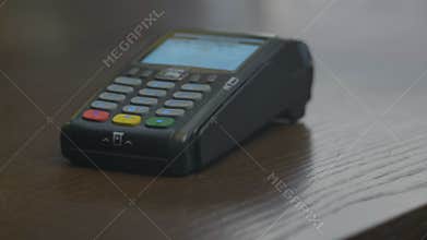 Closeup shot of customer pay over the wireless tradings card-reader. Adult human hands of businessman use bankcard