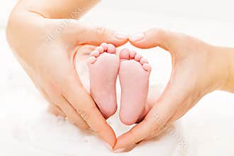 Newborn Baby Feet in Mother Hands Heart, Mom and New Born Kid Foot