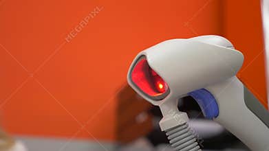Cash register hand scanner blinking. flickers red light