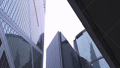 Glass facade business building bottom view in Hong Kong city. Office building and skyscrapers facade with glass window