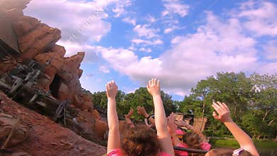 People enjoying amazing Big Thunder Mountain Railroad on cloudy sky background in Magic Kingdom at Walt Disney World  23