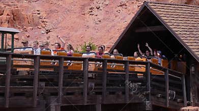 People enjoying amazing Big Thunder Mountain Railroad on cloudy sky background in Magic Kingdom at Walt Disney World  2
