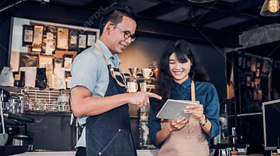Asia Barista waiter take order from customer in coffee shop,cafe owner writing drink order at counter bar,Food and drink business